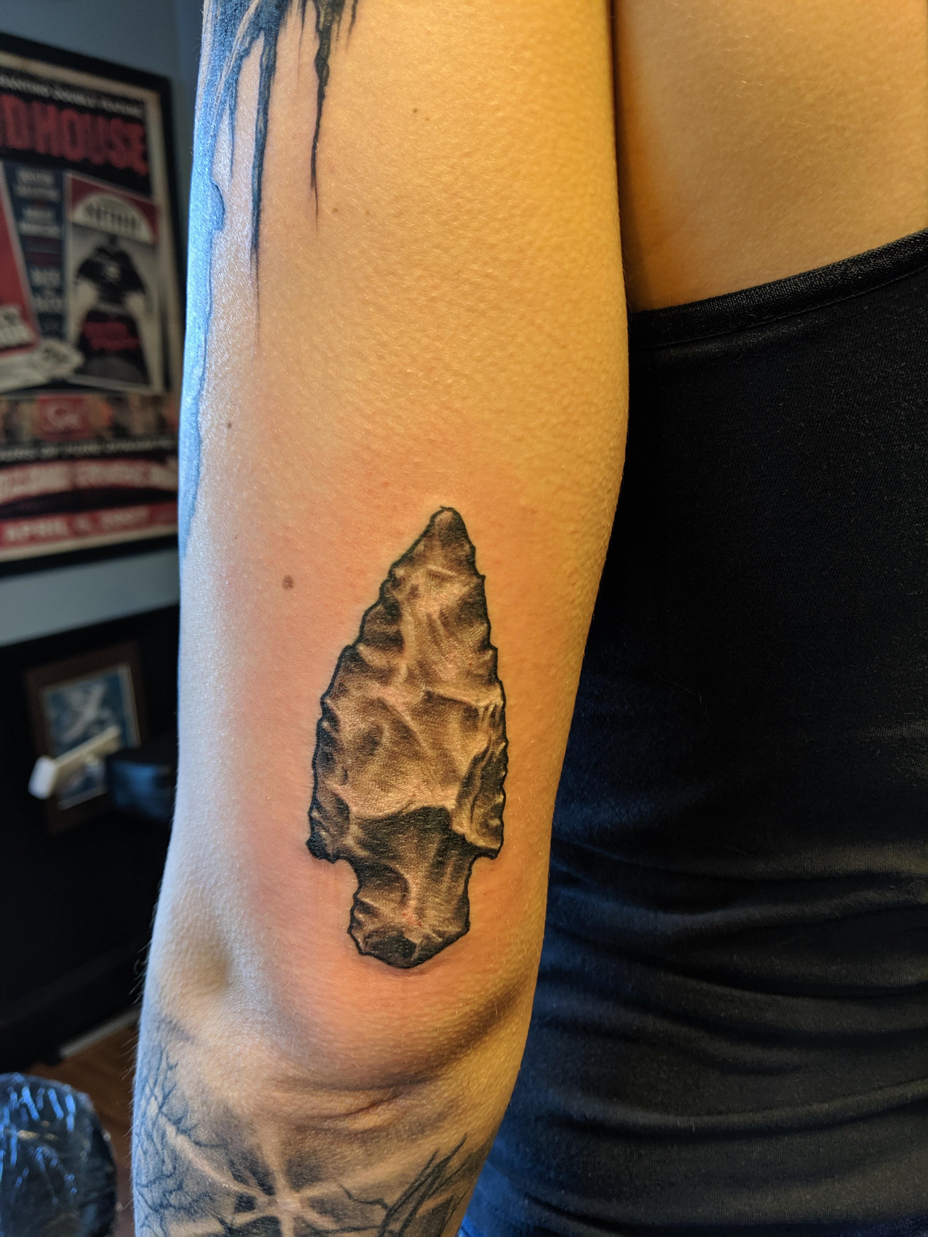 arrowhead tattoos for men with tribal elements