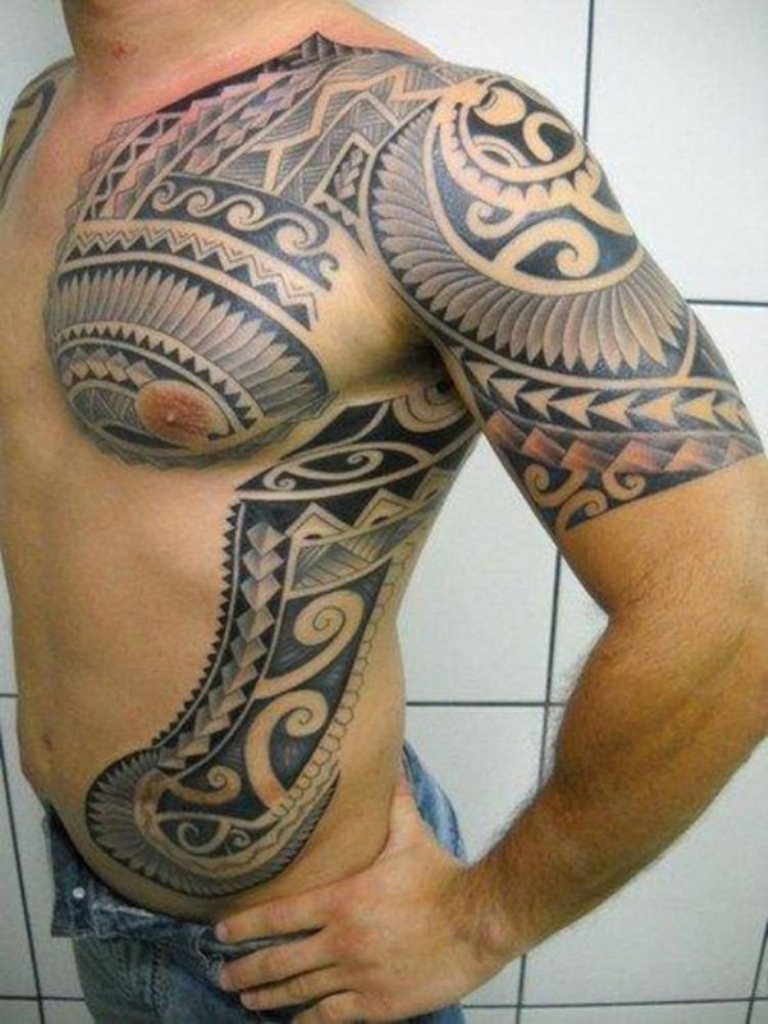 artistic chest and shoulder tattoos for men