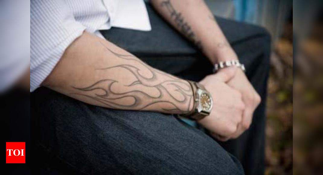 artistic expressions of multiple sclerosis through tattoos for men.