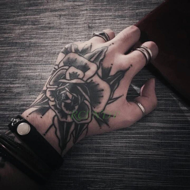 artistic flower tattoos for men on hand