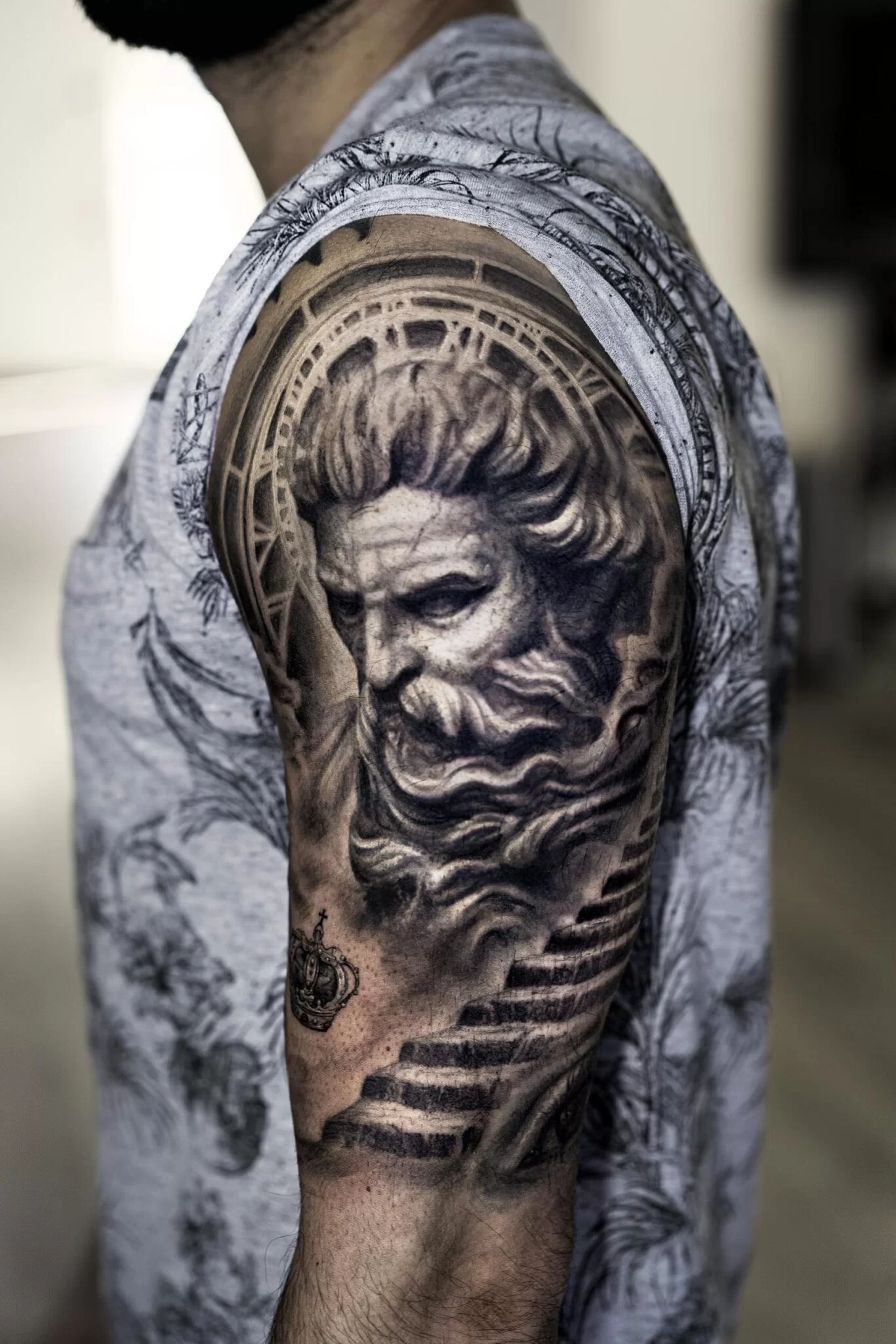 artistic interpretations of greek god tattoos for men