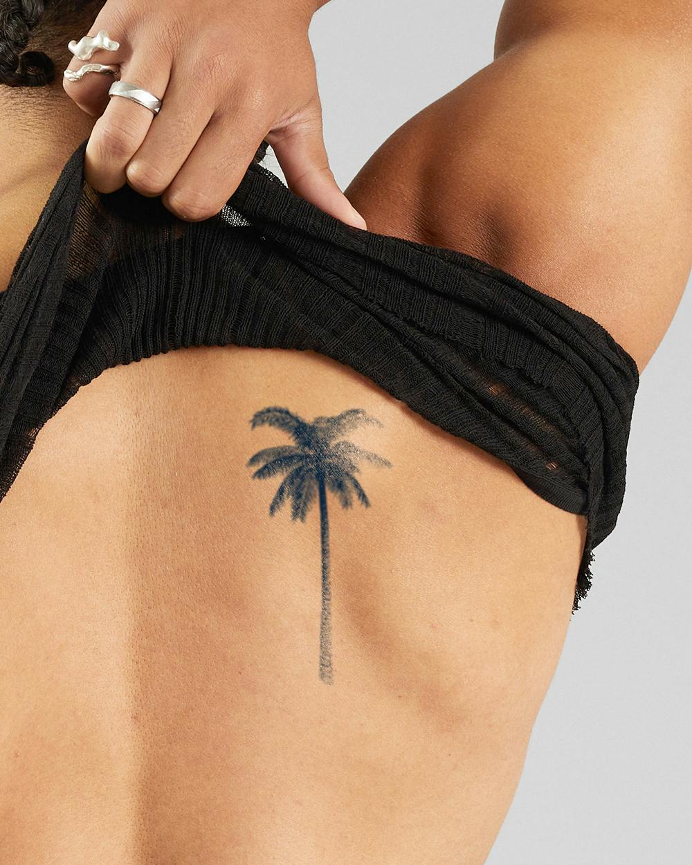 artistic palm size tattoos for men