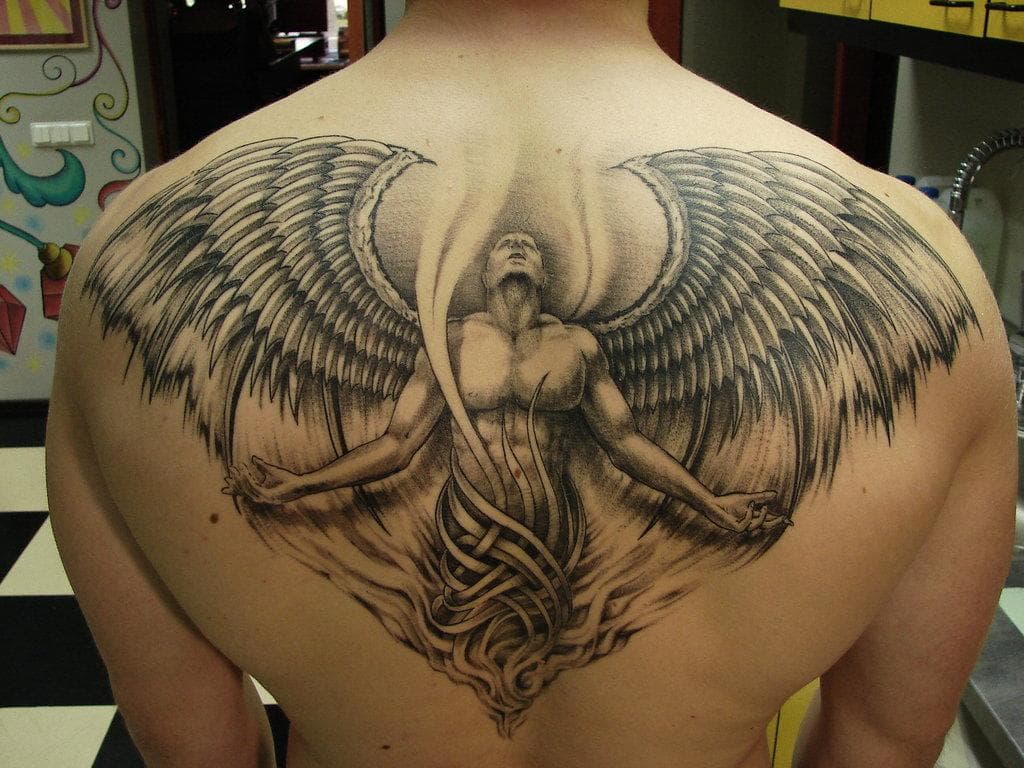 artistic upper back tattoo cover up ideas for men