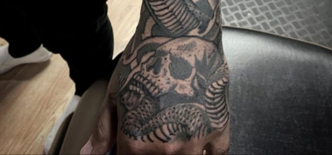 back of the hand tattoos for men symbolism