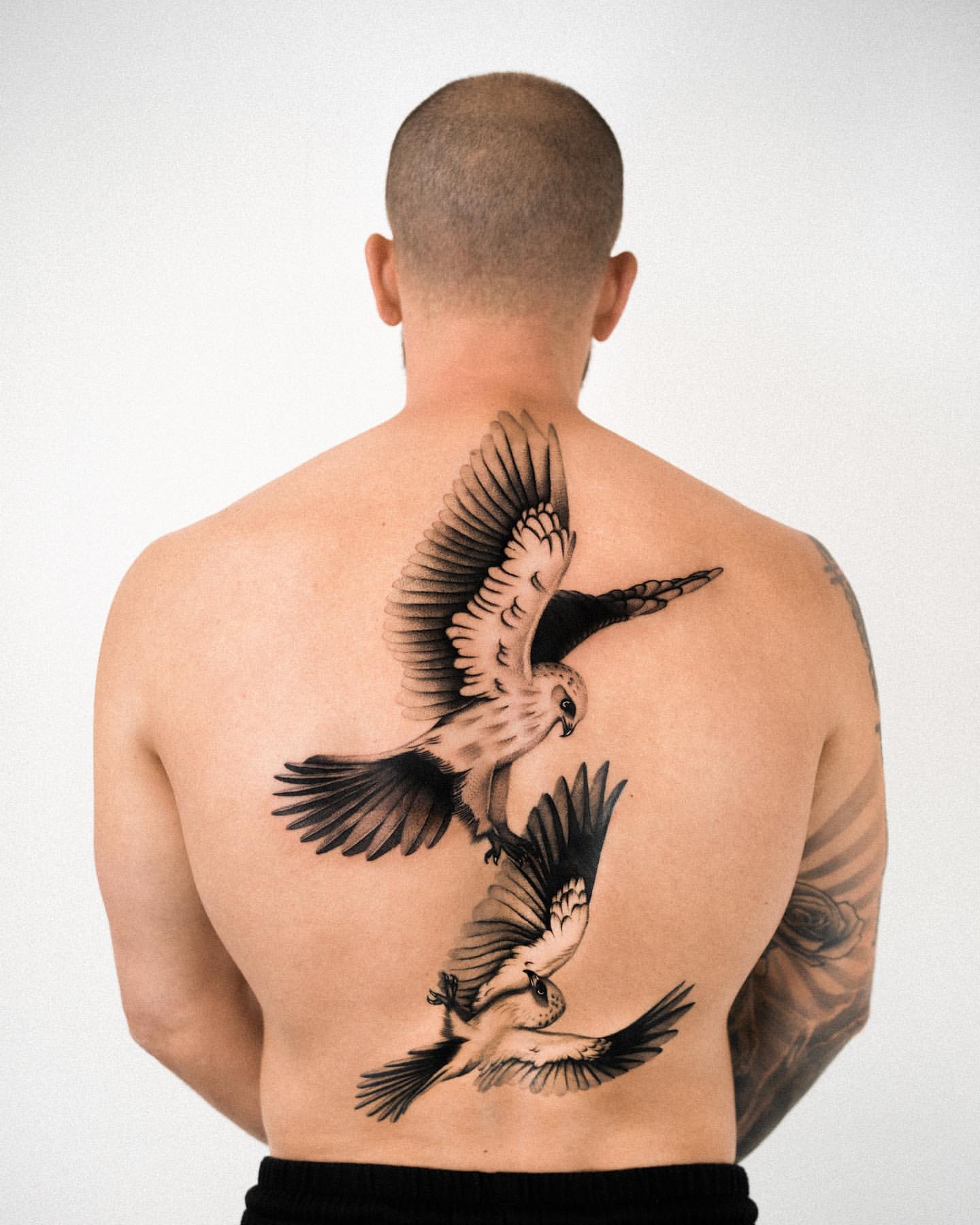 bird neck tattoos for men symbolism