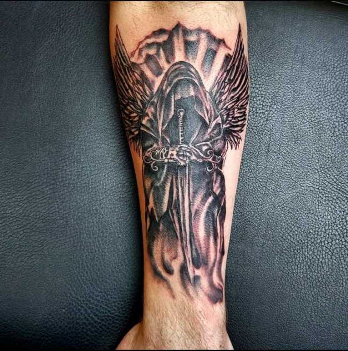 bold angel tattoos for men forearm inspiration