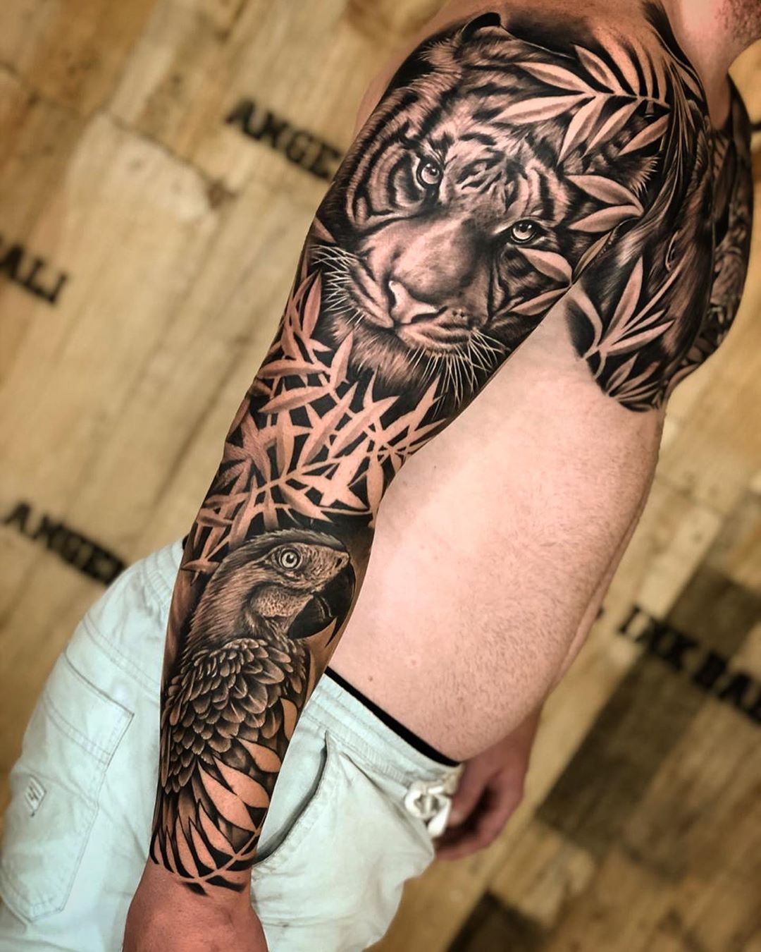 bold animal sleeve tattoos for men