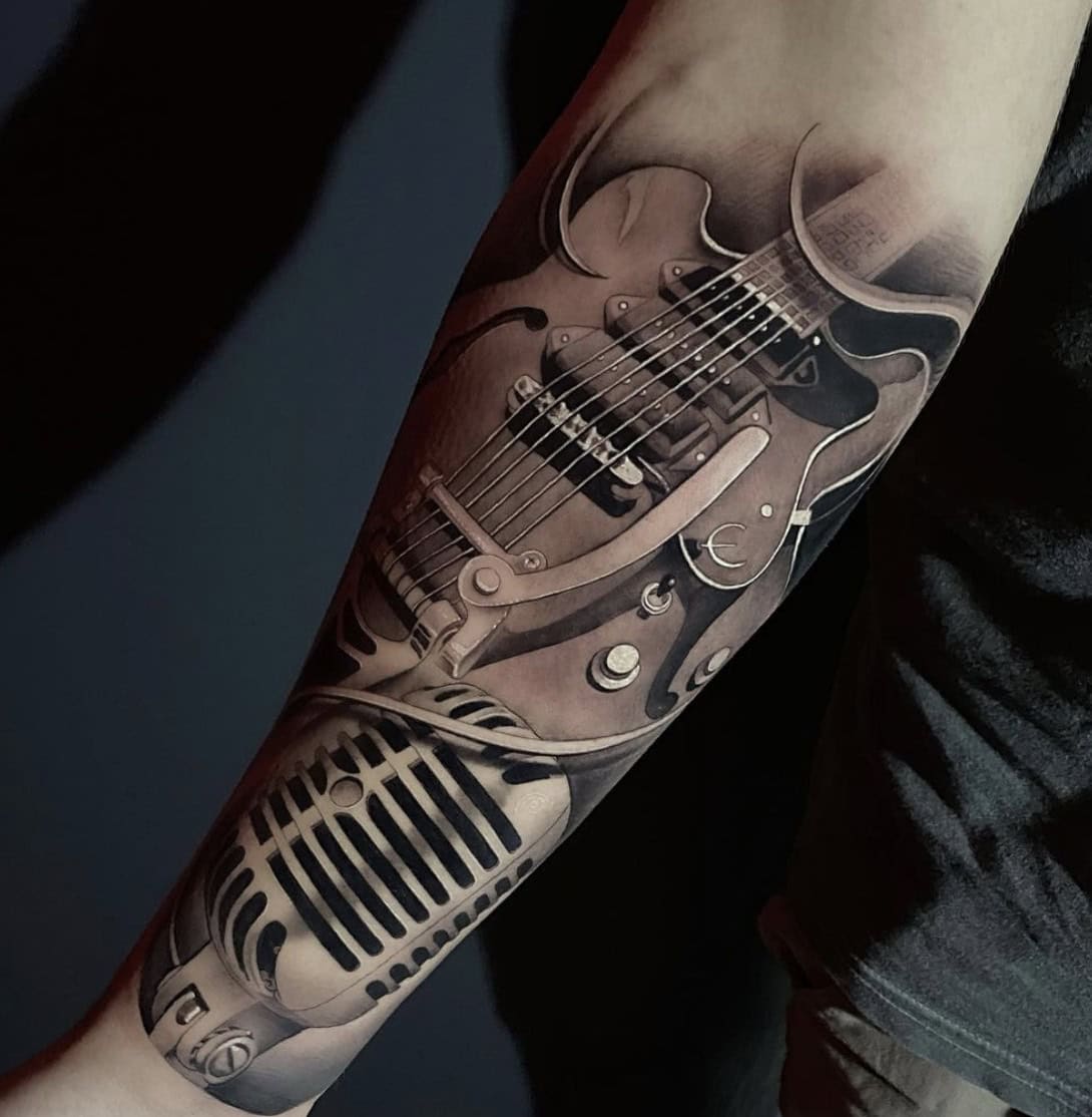 bold guitar tattoos for men