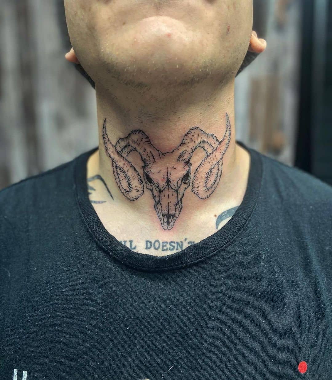 bold throat tattoos for men