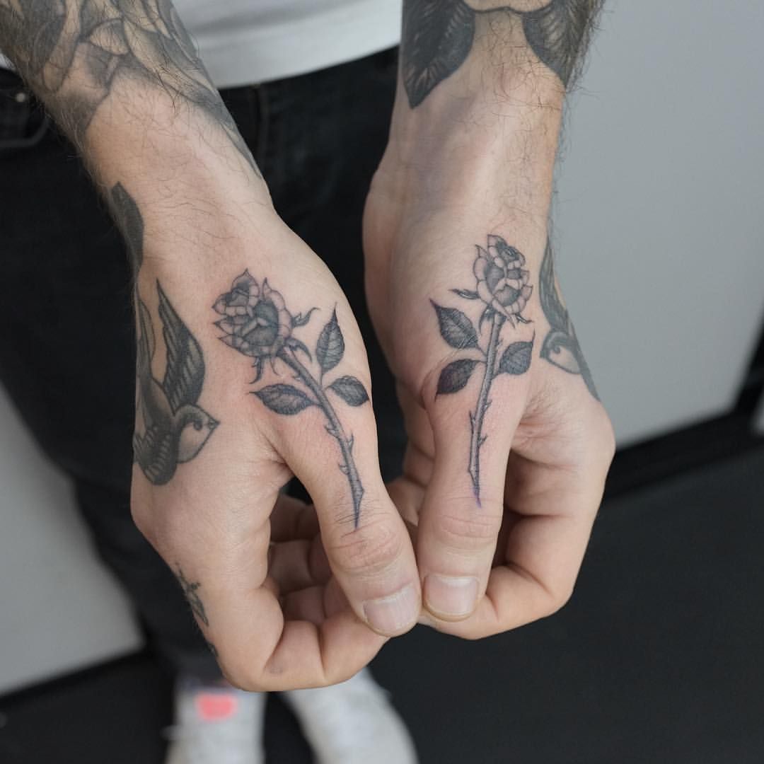 bold thumb tattoos for men