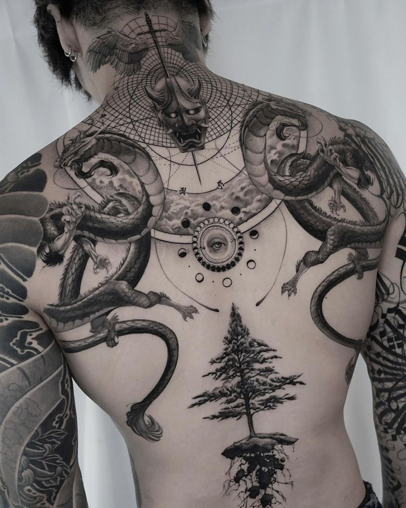 bold upper back tattoo cover up ideas for men.