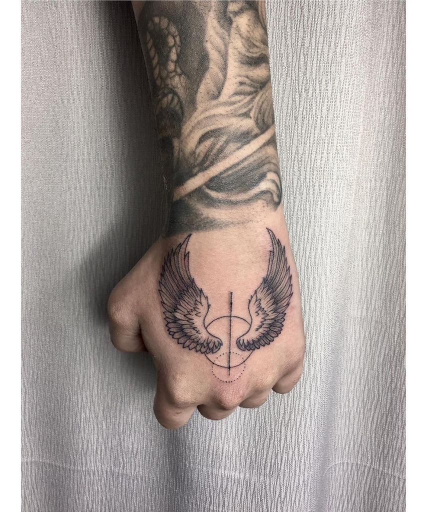 bold wing tattoos for men