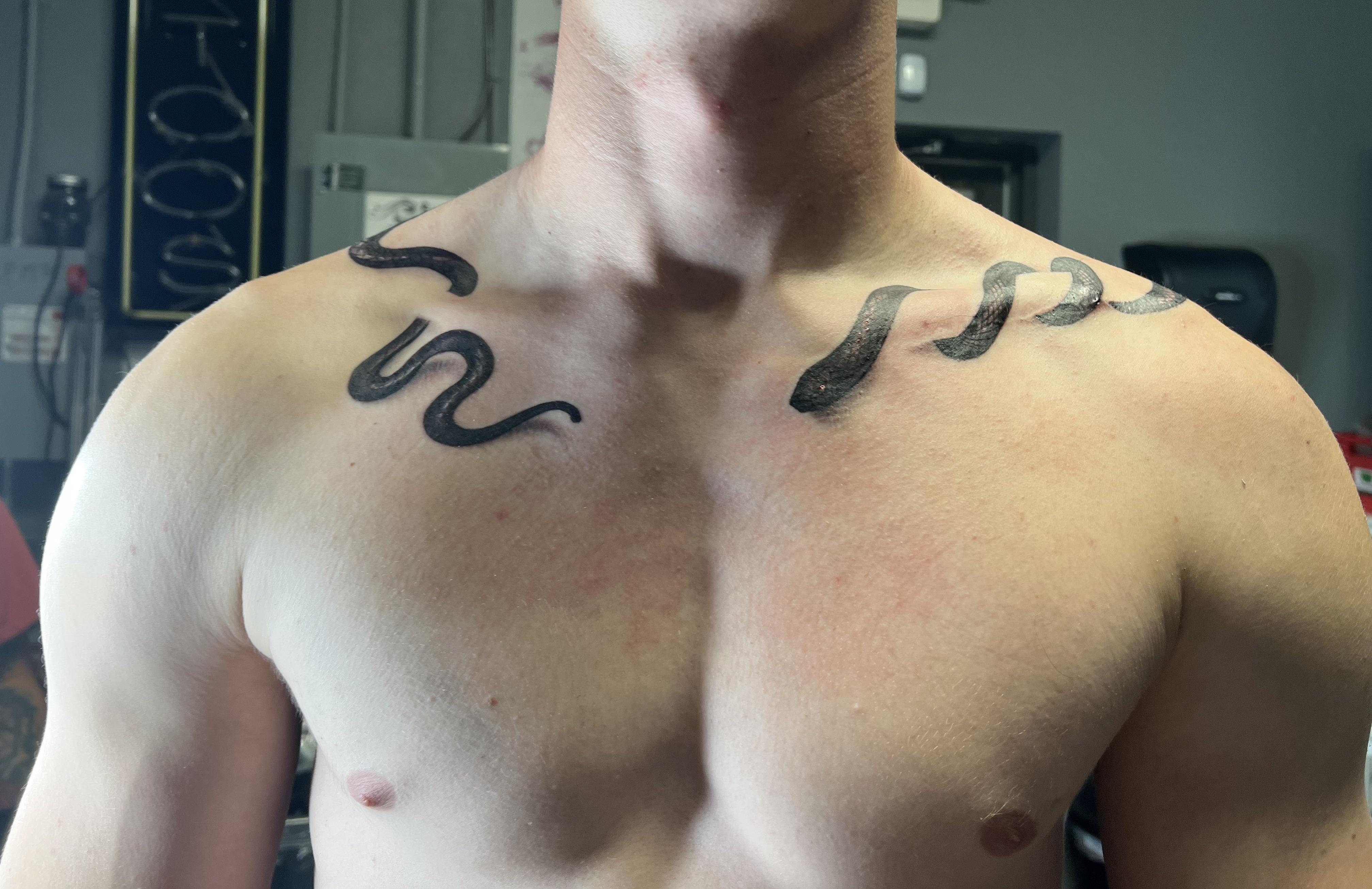 collar bone tattoos for men in black and gray