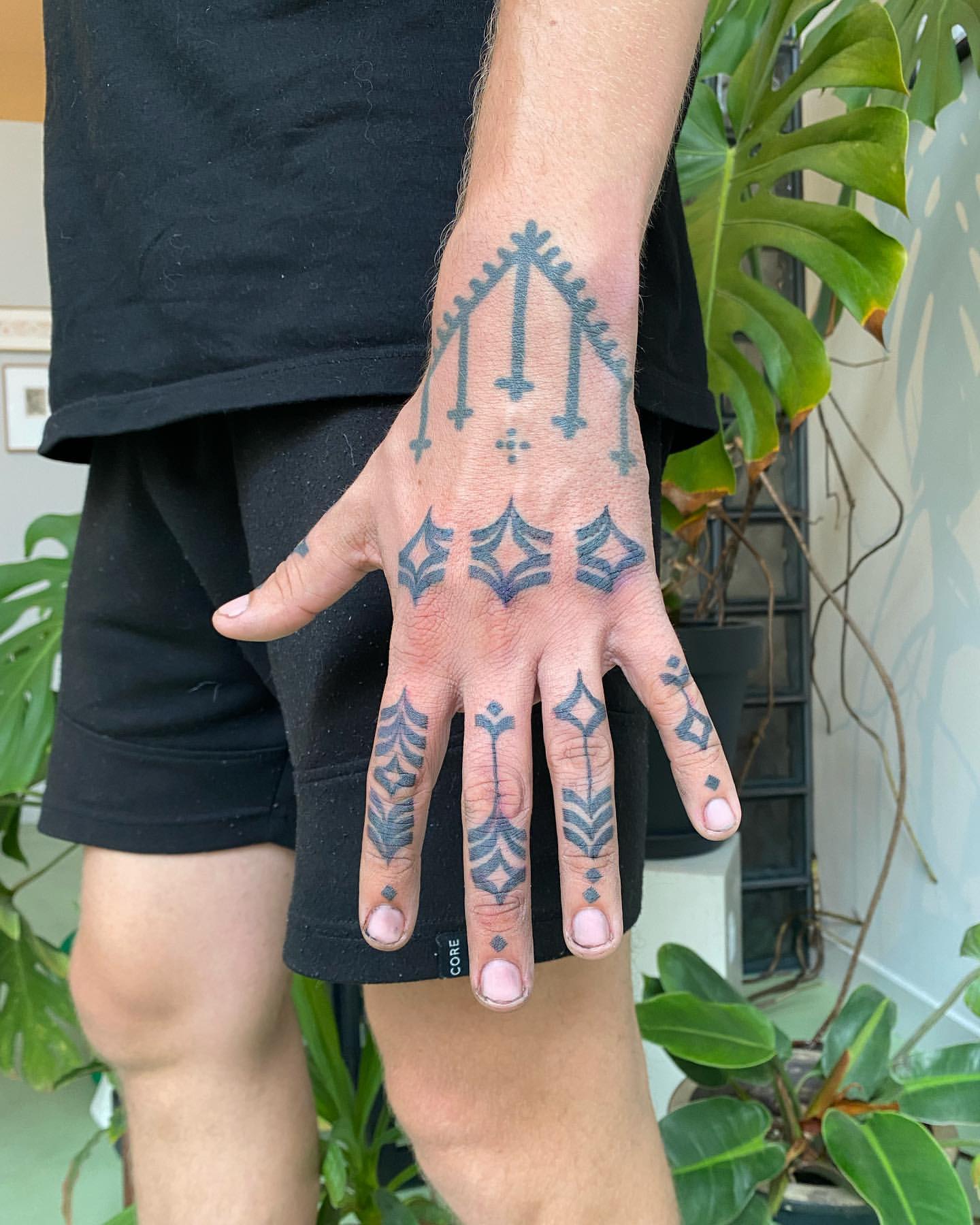 cool designs for men’s hand tattoos