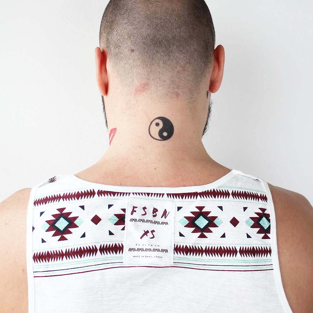 creative placements for Yin Yang tattoos on men