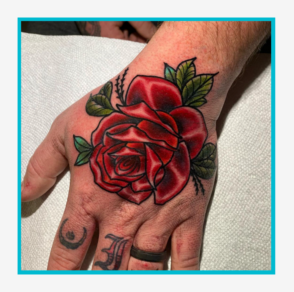 creative placements of rose tattoos for men on hand