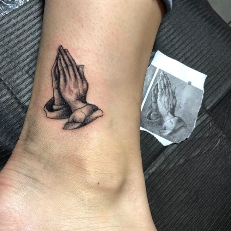 creative praying hands tattoos for men.