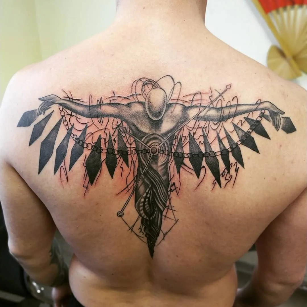 creative upper back tattoos for men