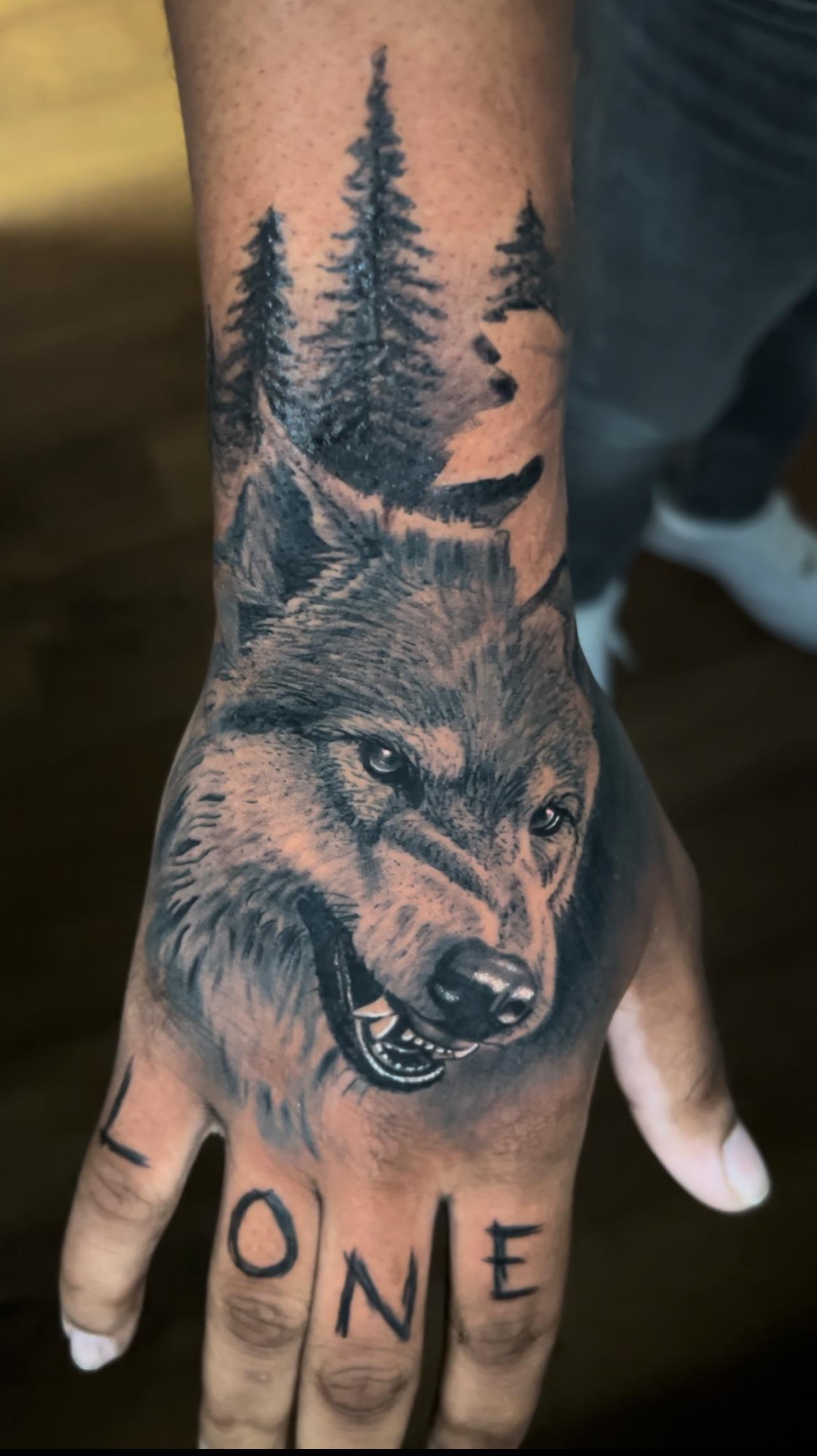 creative wolf hand tattoos for men