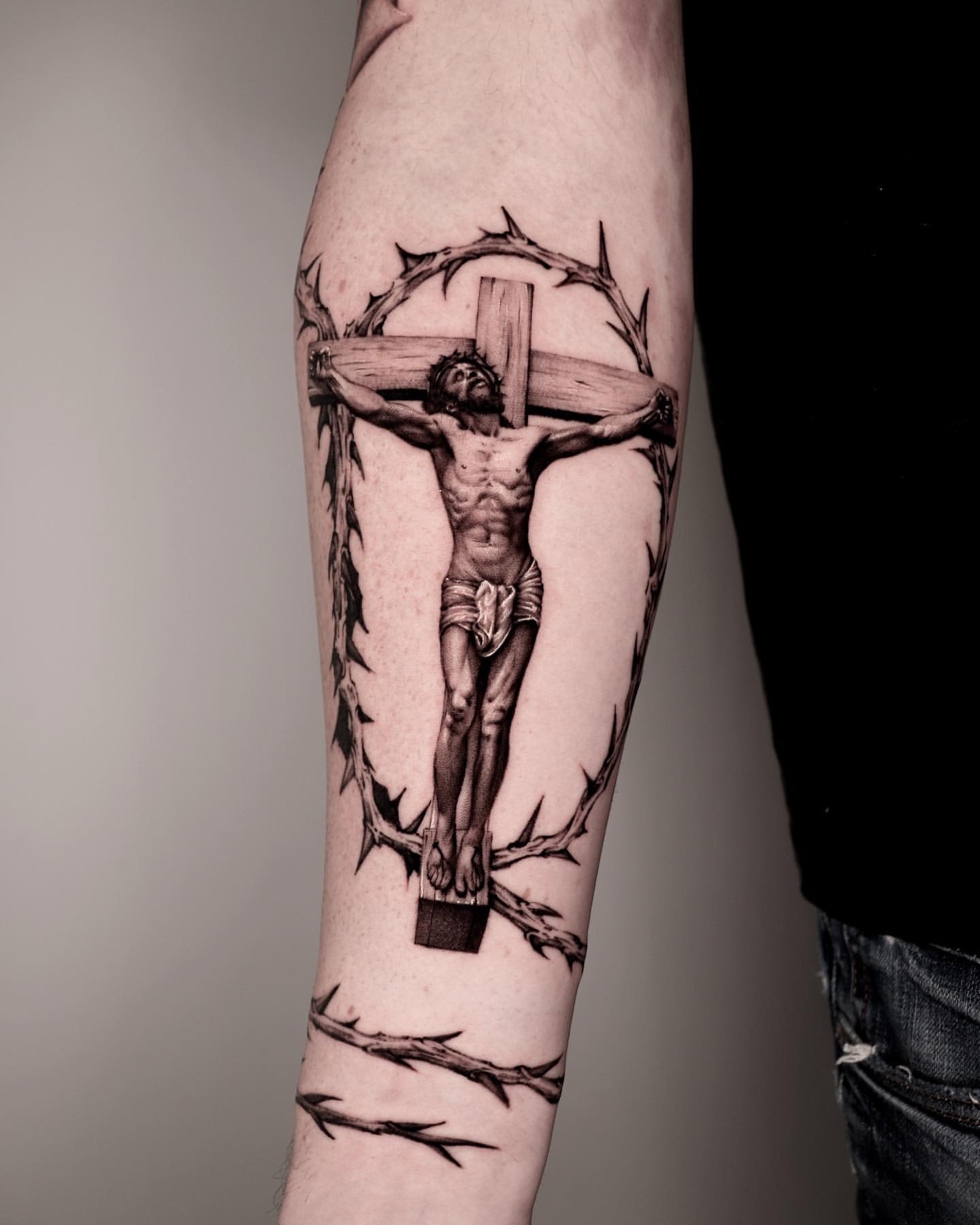 custom forearm Cross and rose tattoo options for men.