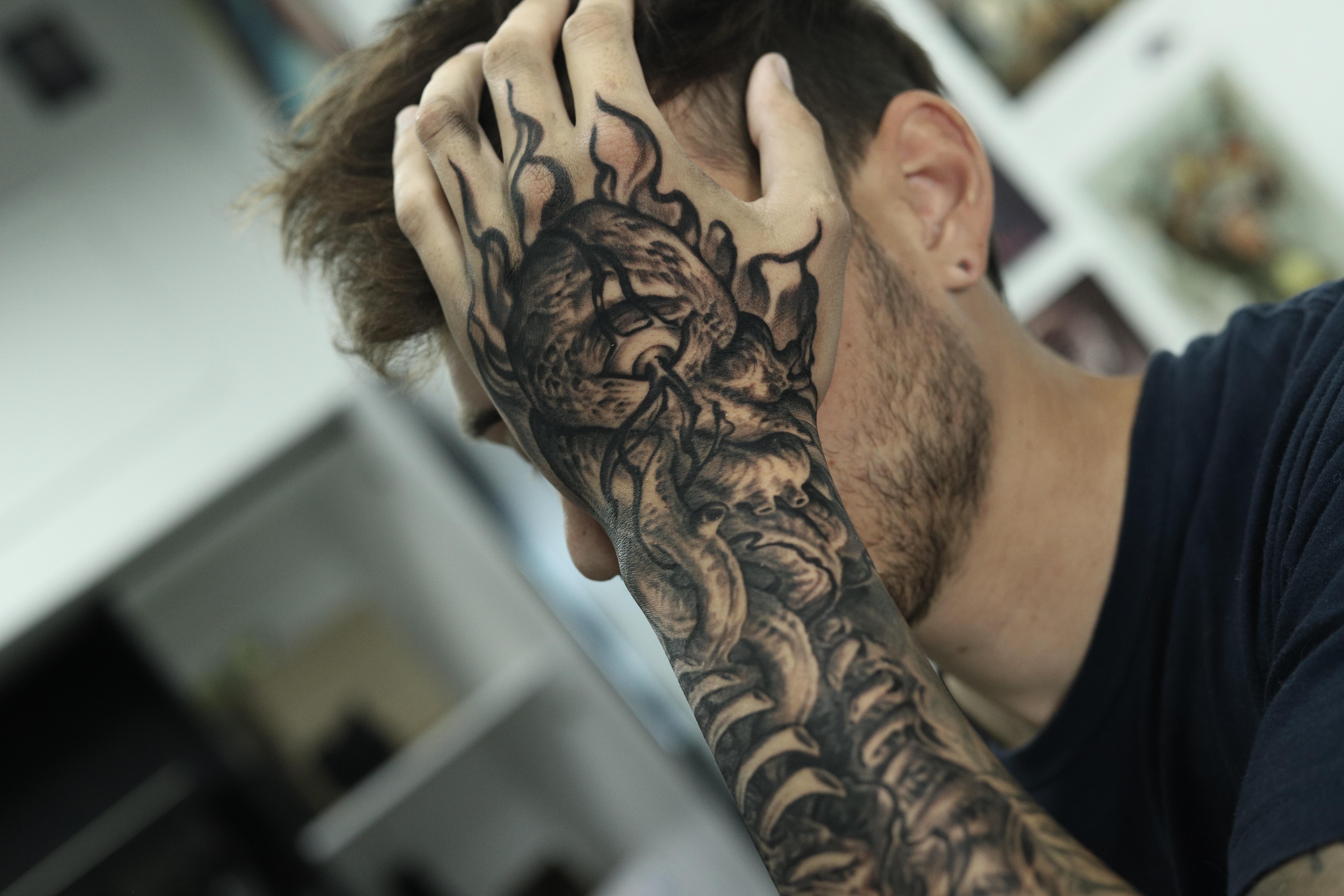 customizing eye hand tattoos for men.