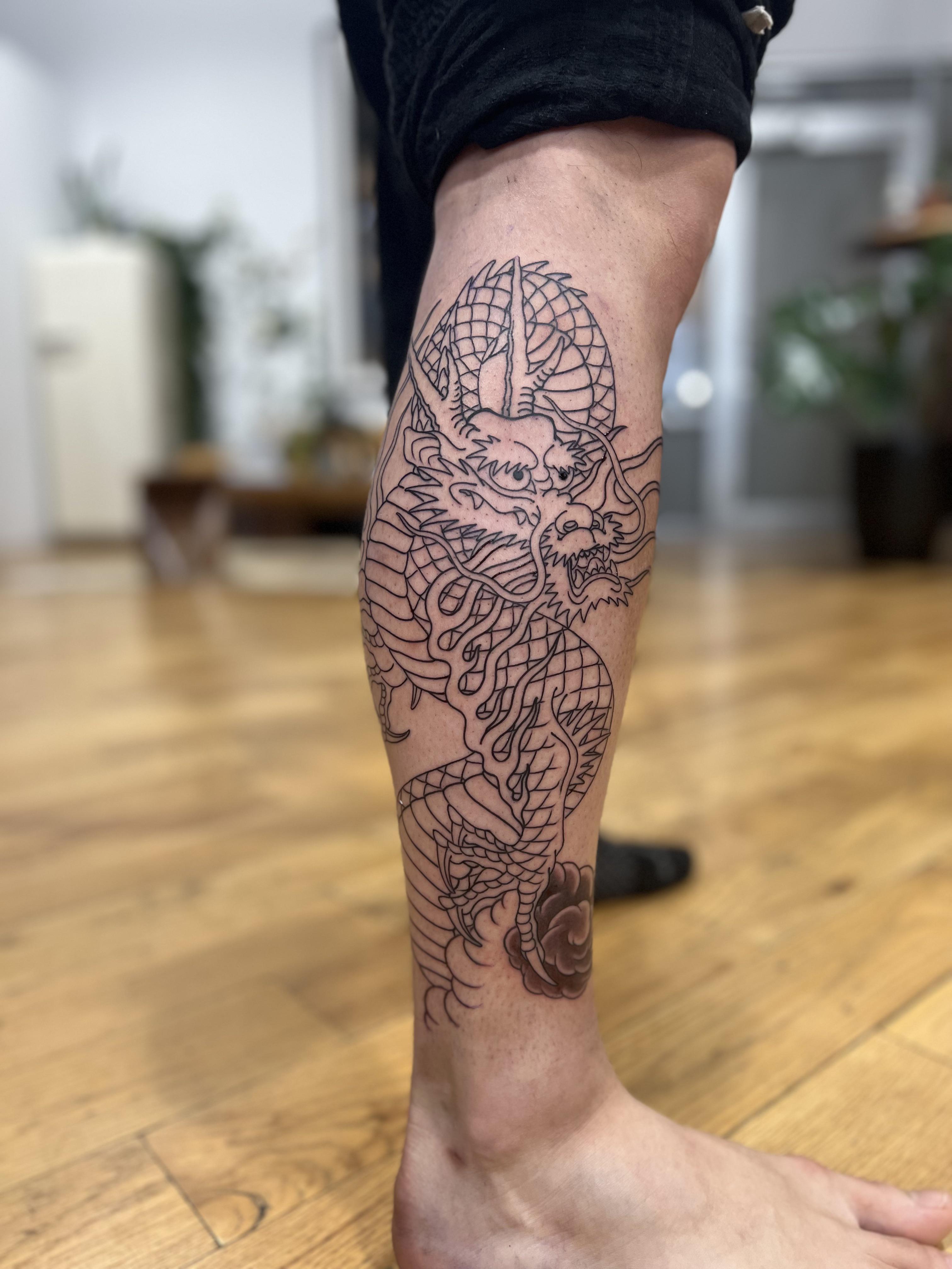 dragon leg tattoos for men symbolism