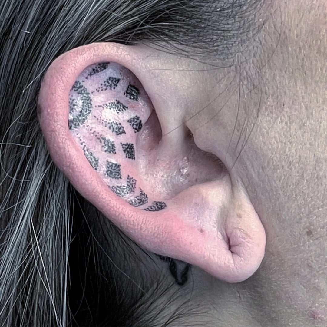 ear tattoos for men symbolism