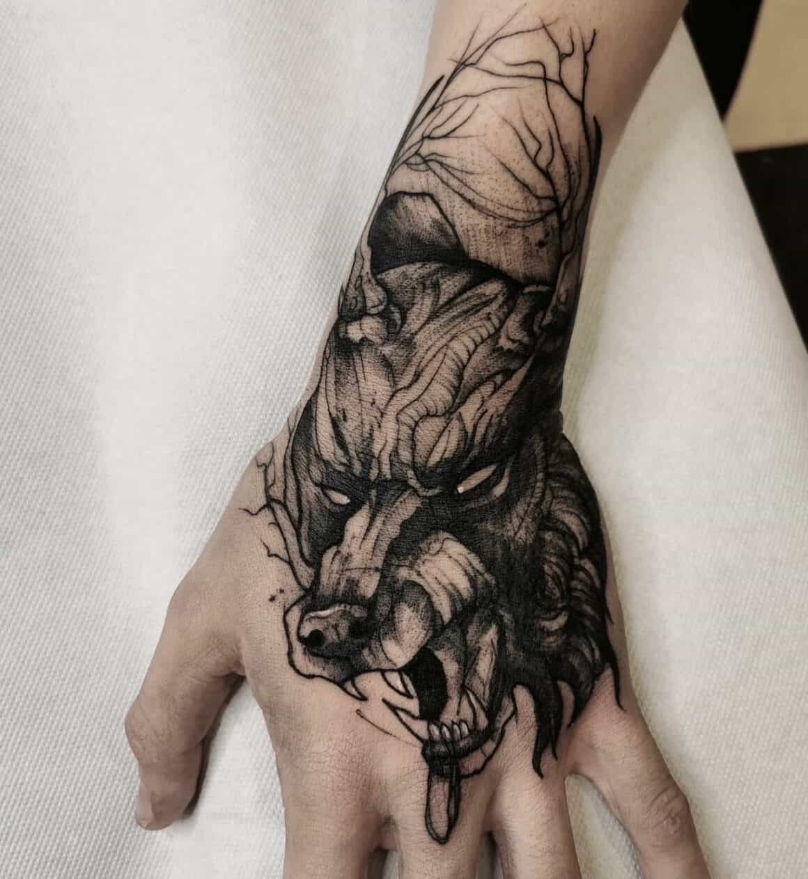 fierce wolf hand tattoos for men