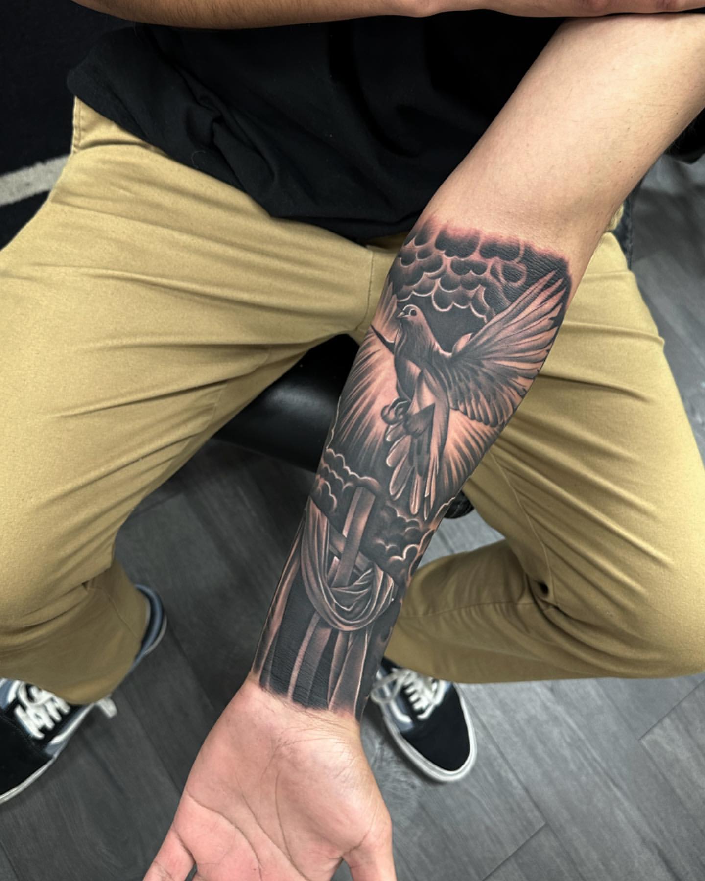 forearm Cross and rose tattoo symbolism for men