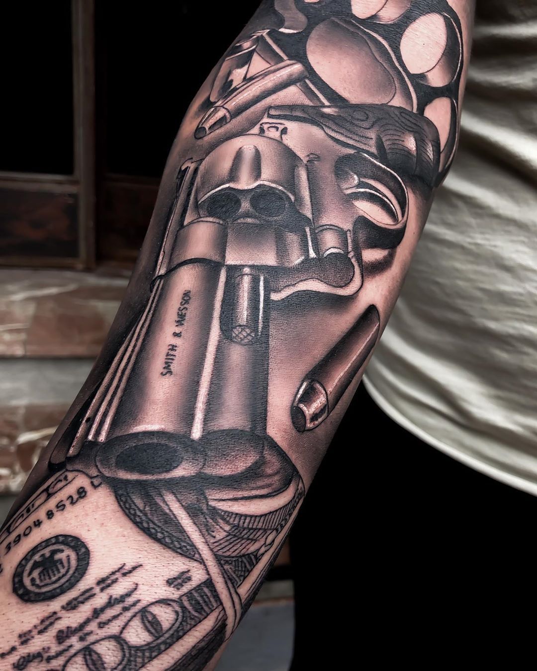 gun tattoo placements for men.