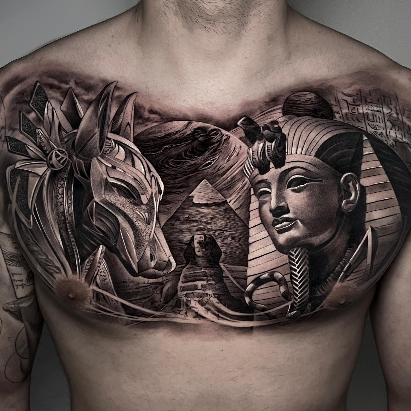 how to design black Egyptian chest tattoos for men