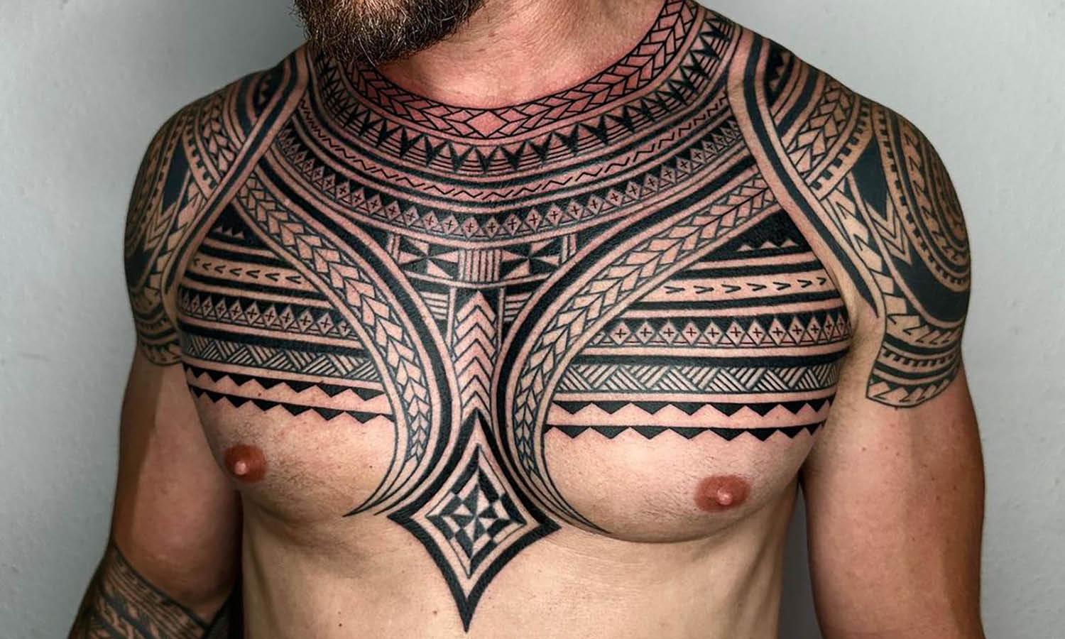 innovative chest piece tattoo designs for men