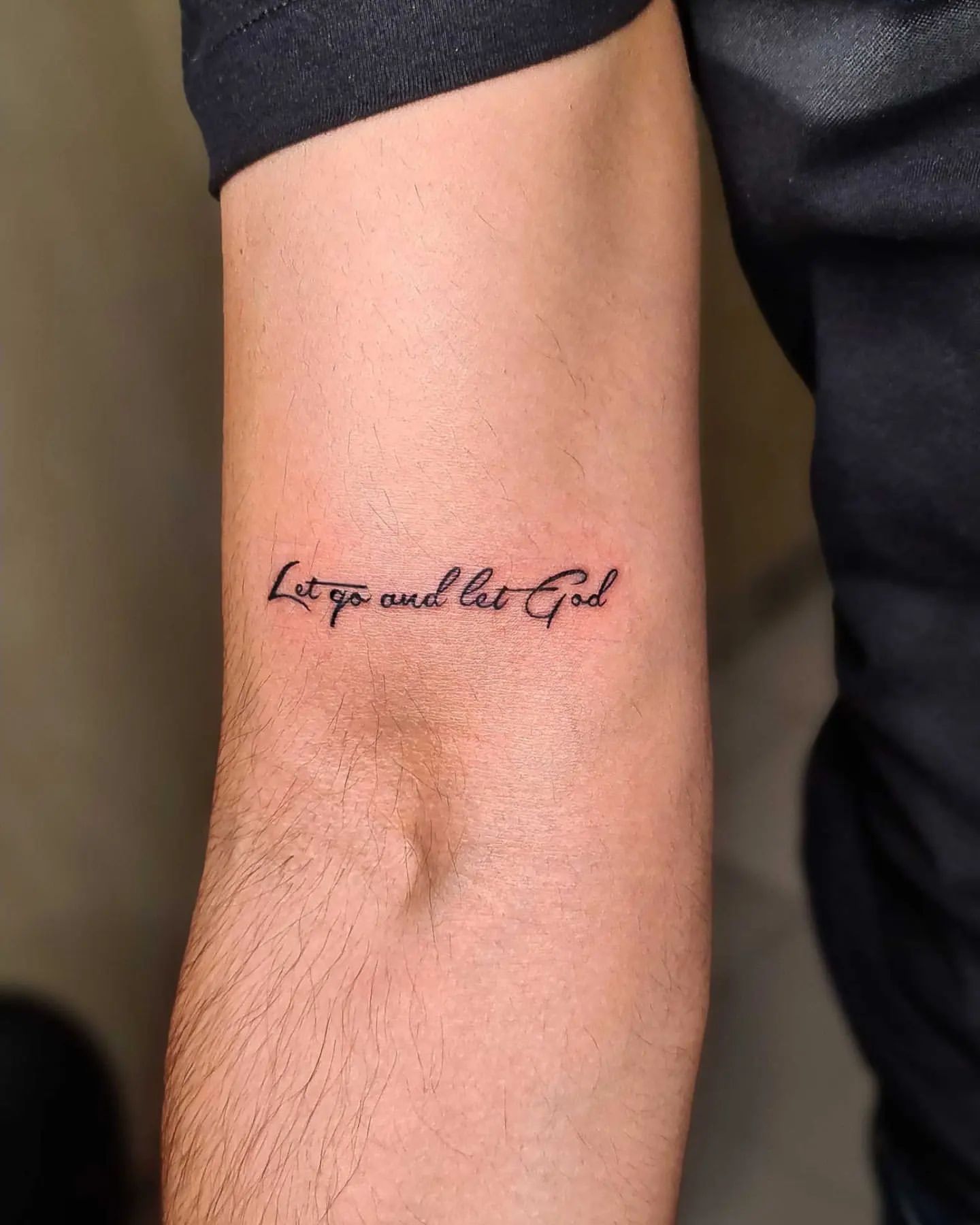 inspirational cursive tattoos for men.