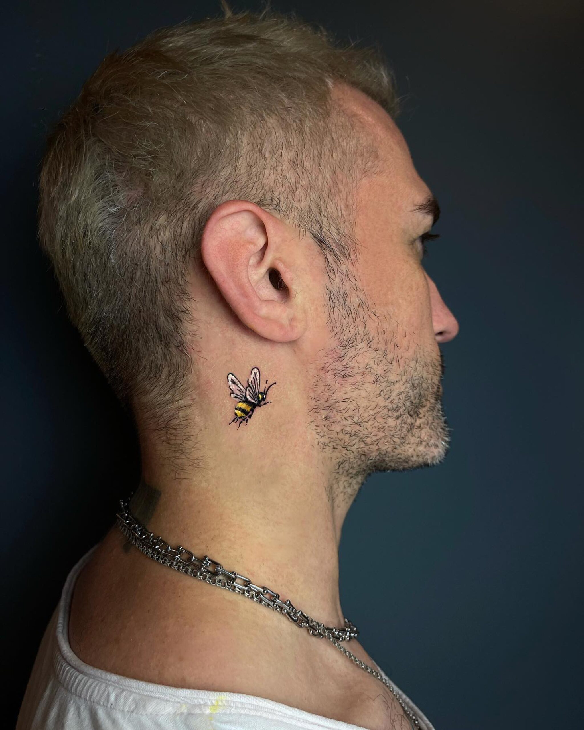 intricate behind the ear tattoos for men