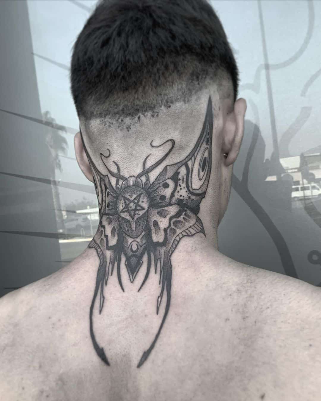 intricate neck tattoos for men with Chinese motifs