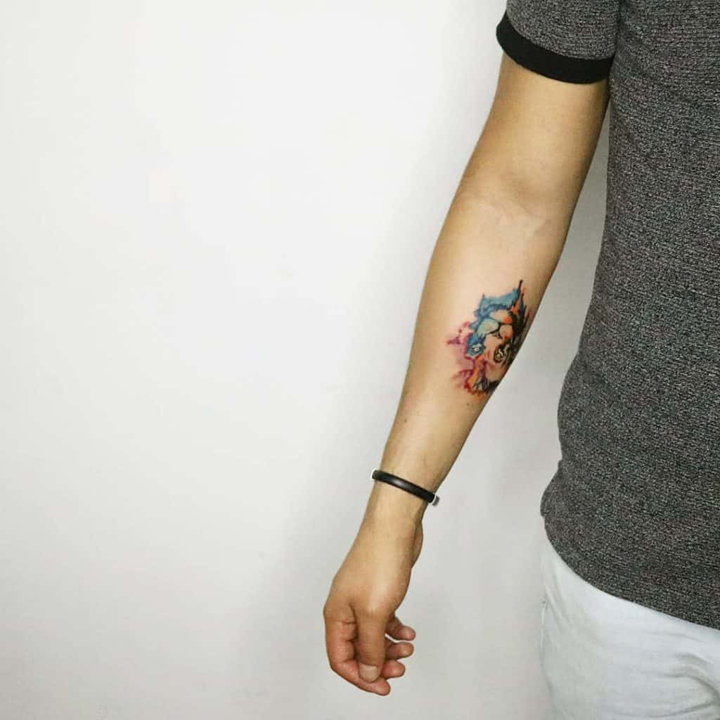 intricate small colored tattoos for men