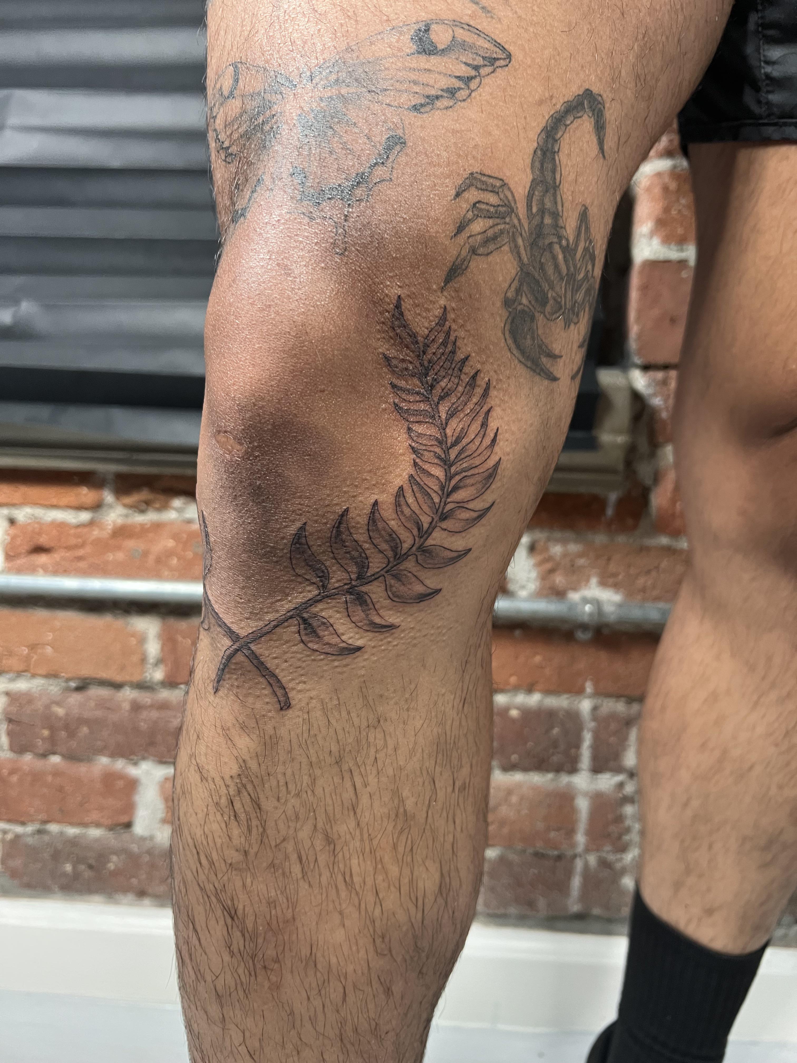 knee tattoos for men with meaning