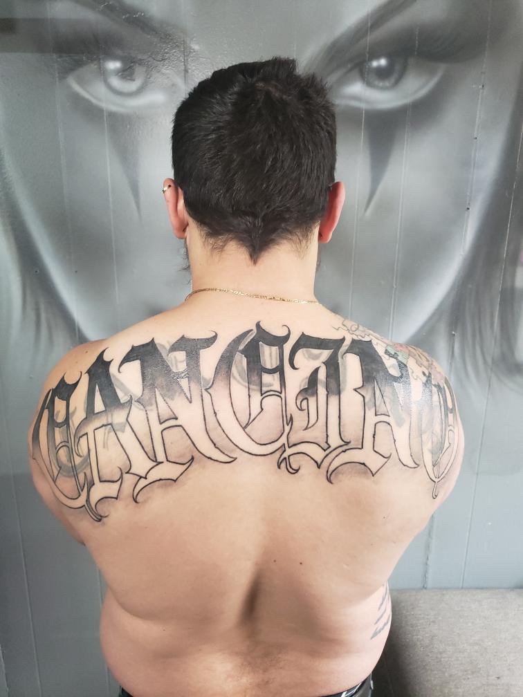 last name back tattoos for men 0017