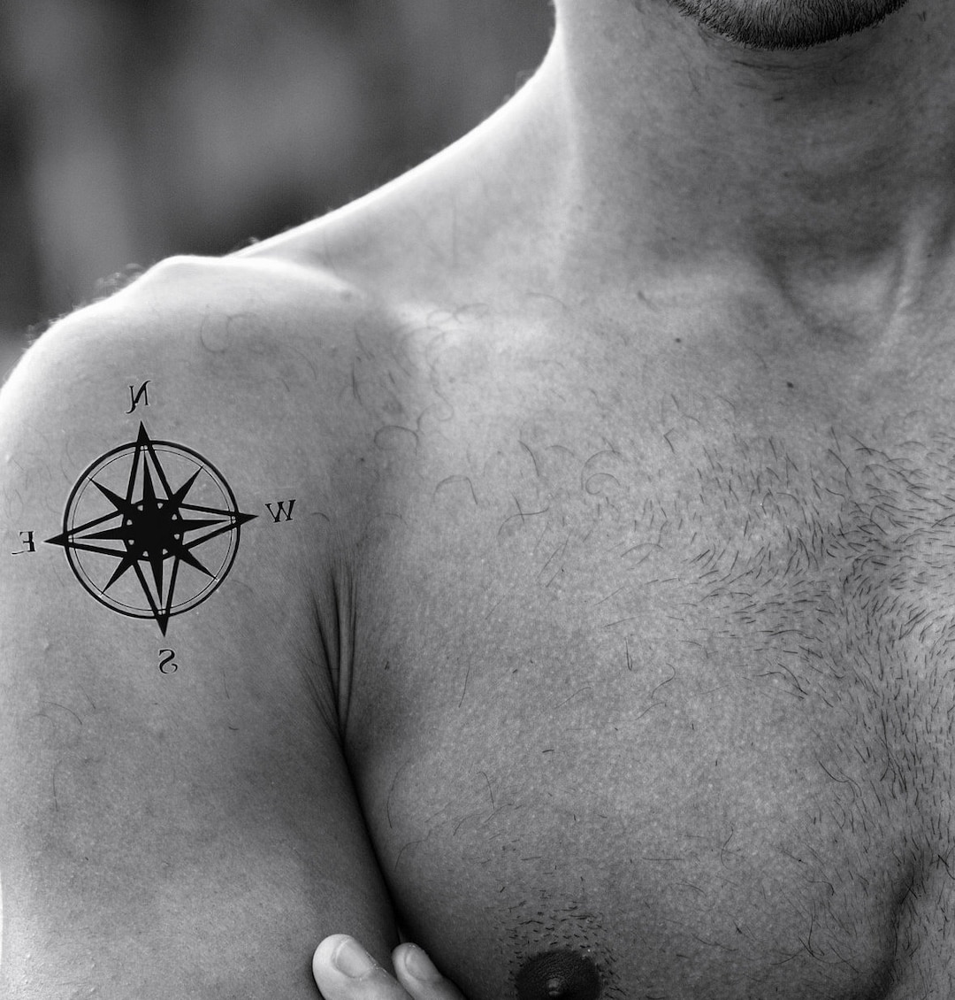 masculine compass chest tattoo styles.