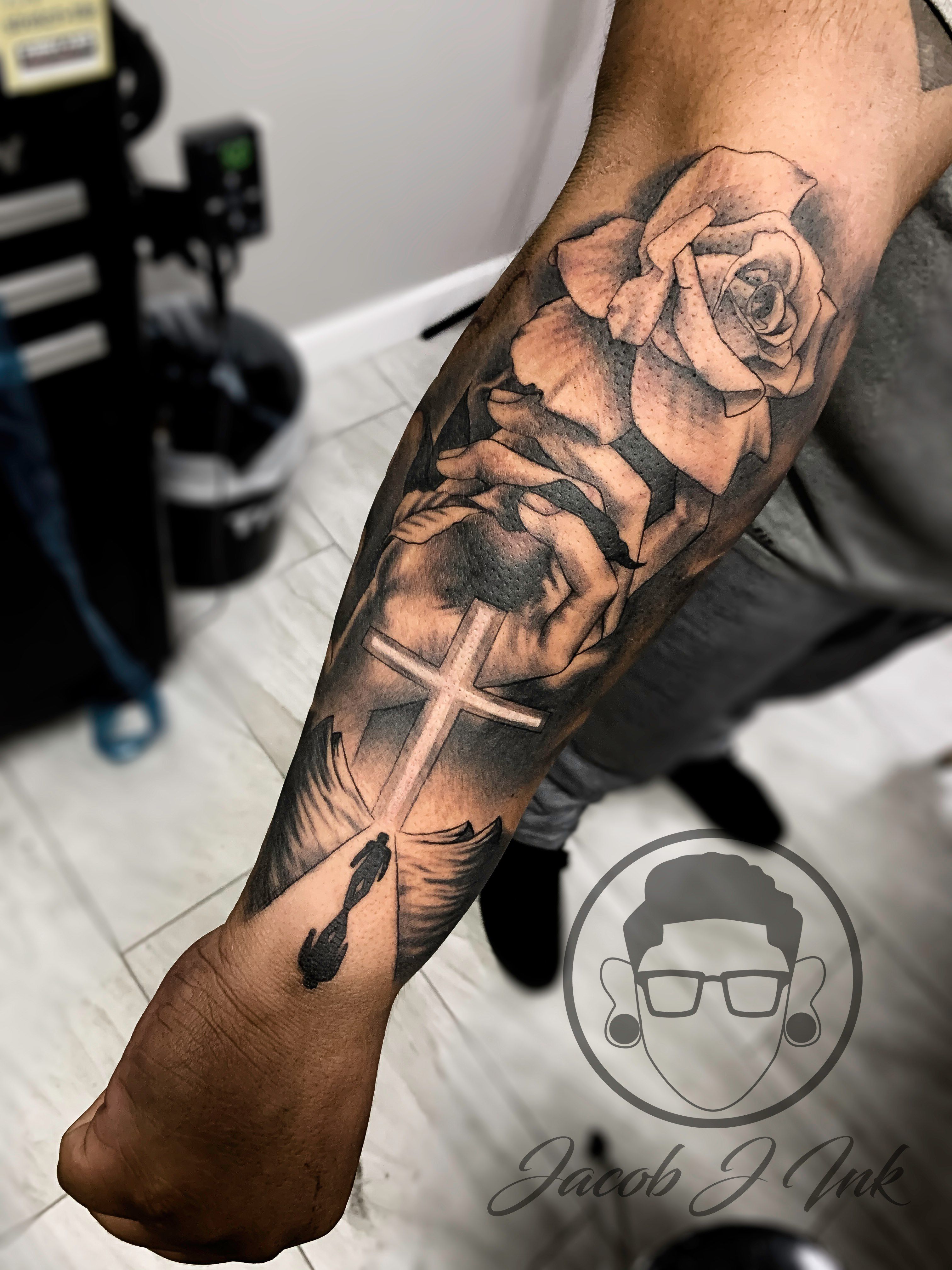 meaning of forearm Cross and rose tattoos for men