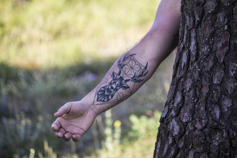 meaningful arm tattoos for men 0012