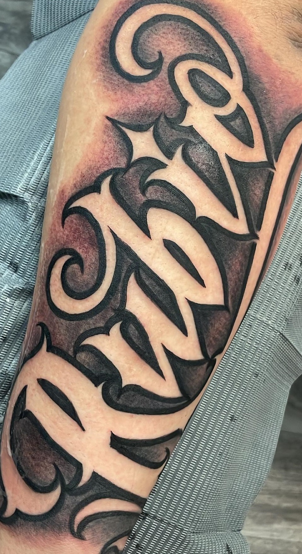 meaningful forearm name tattoos for men.