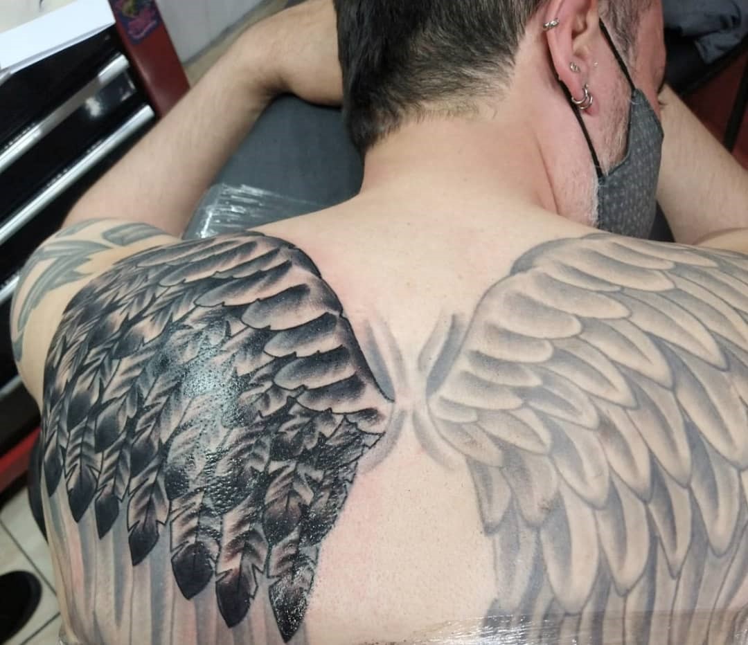 mens wing tattoo for the back 0034