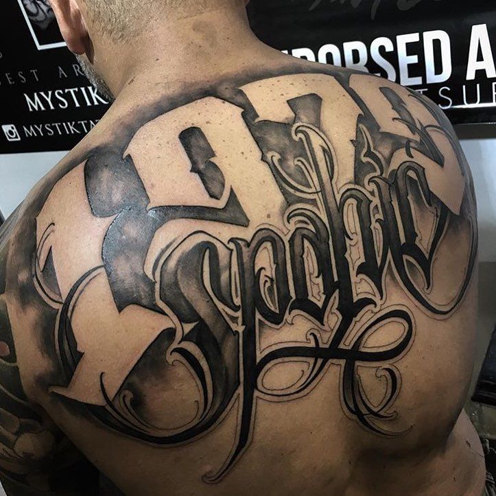 personal stories depicted in back tattoos for men letters