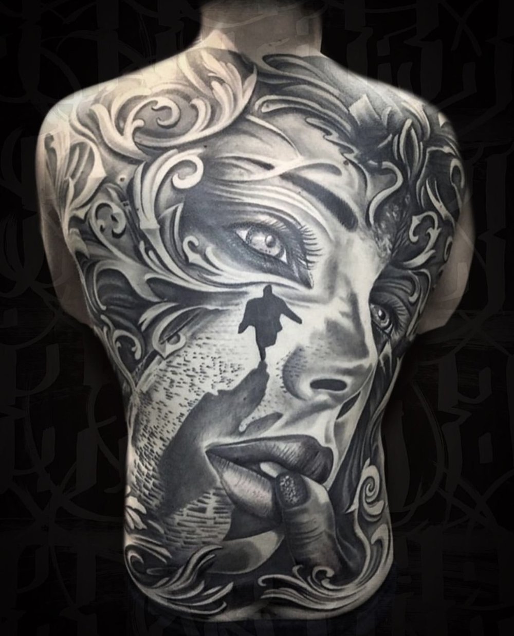 popular black back tattoos for men