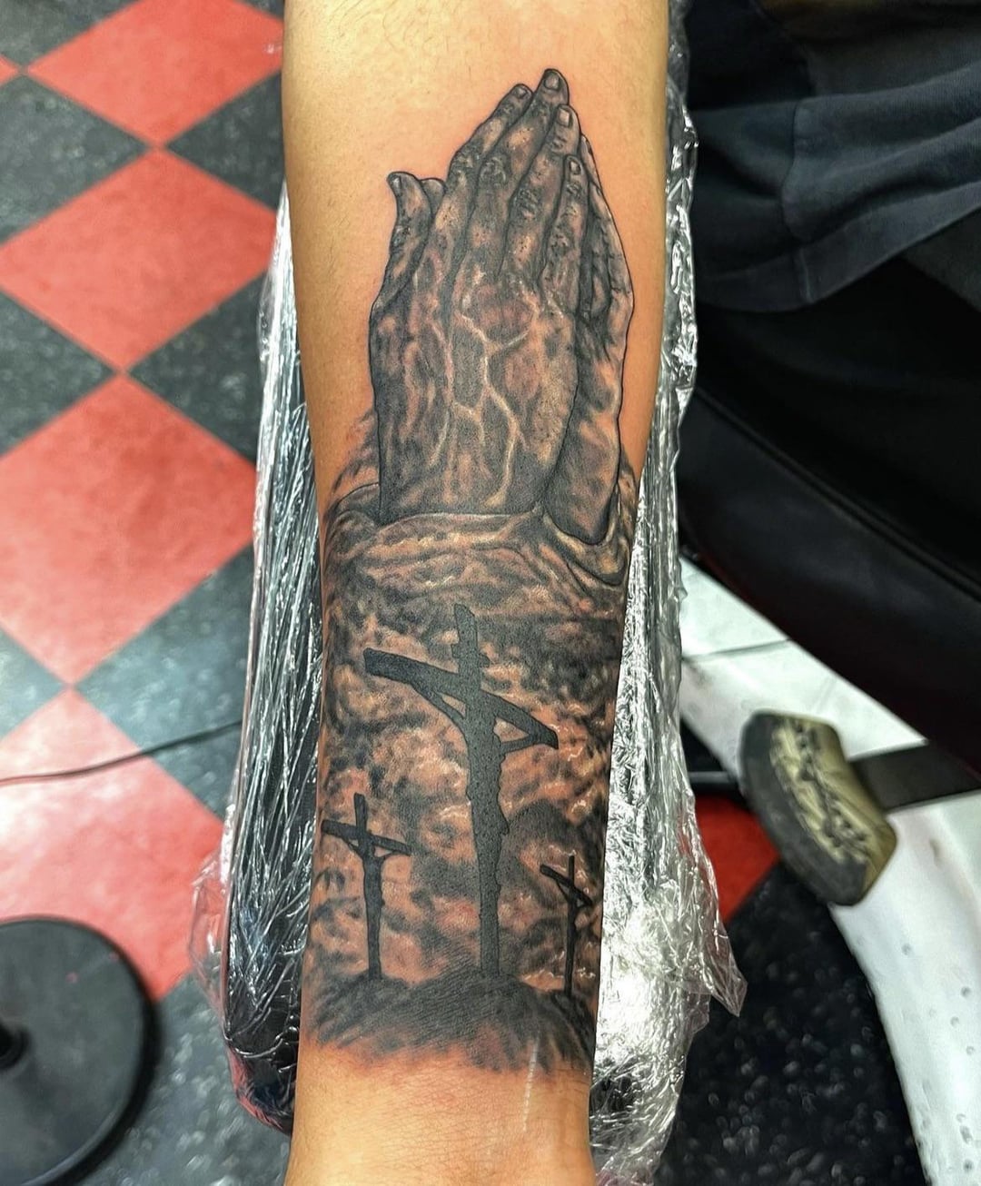 praying hands tattoo for men