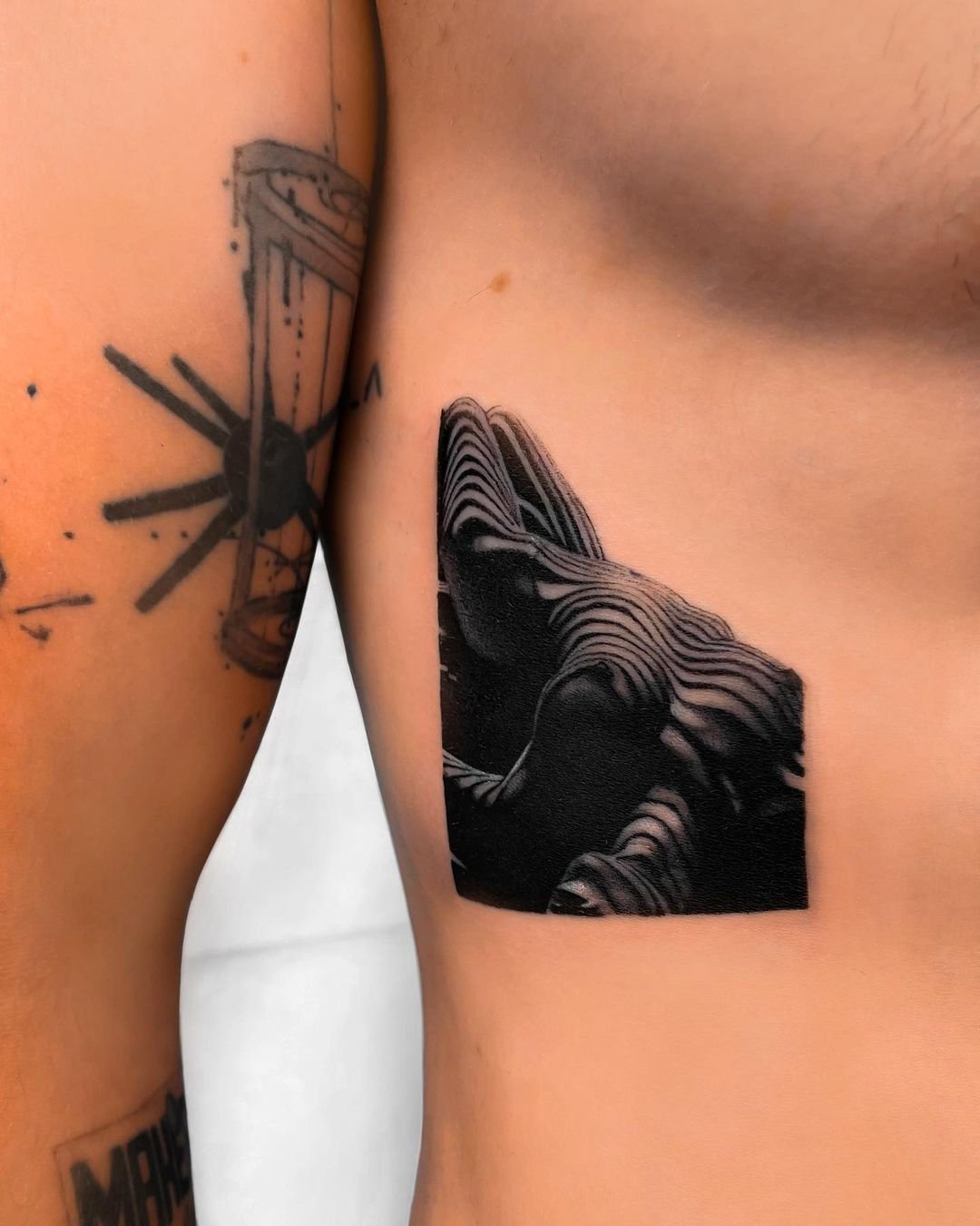 rib tattoos for men 0018