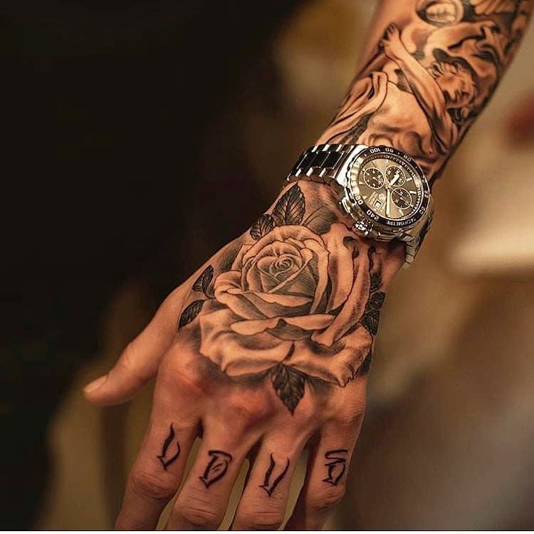 rose tattoos for men on hand symbolism