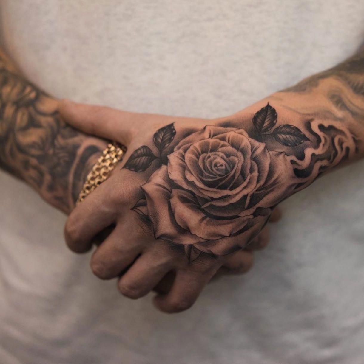 rose tattoos for men on hand trends.