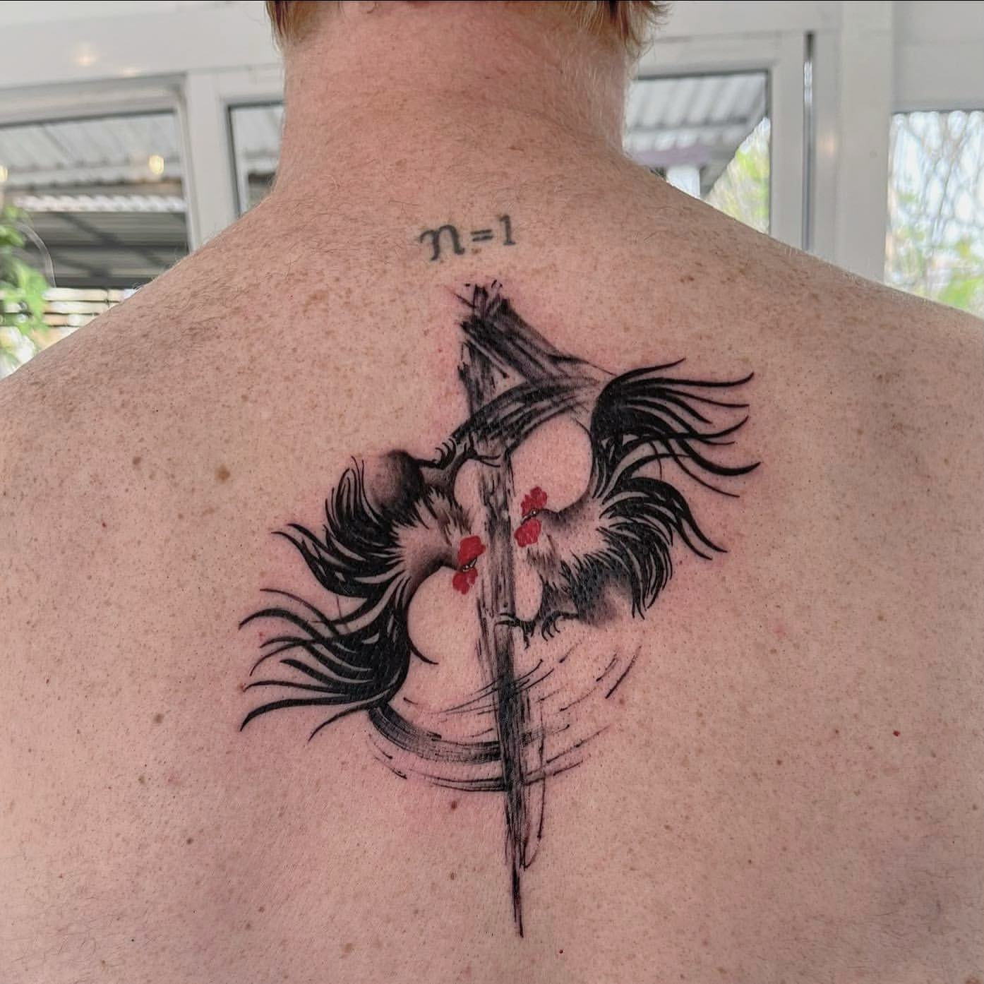 small tattoos for men on back 0015